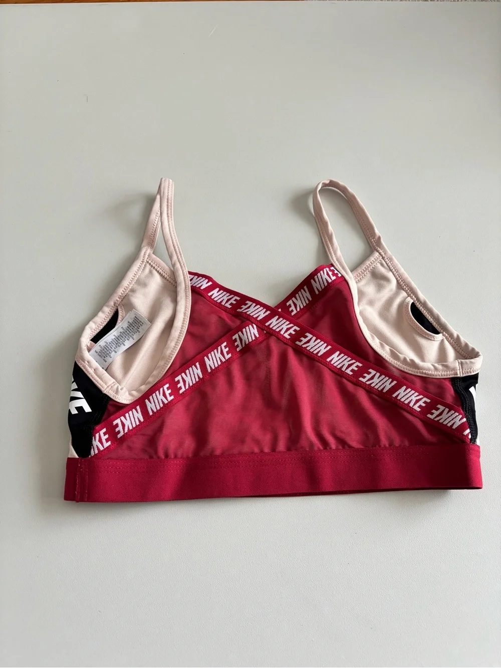 Big Girls Nike Pink Sports Bra with Maroon Band and Black Logo Trim